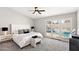 The primary bedroom boasts backyard pool views and carpeted floors at 7108 W Corrine Dr, Peoria, AZ 85381