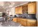 Home bar with wood cabinets, a wine rack, and granite countertops for the wet bar at 7131 N 40Th St, Paradise Valley, AZ 85253