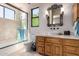 Modern bathroom with a glass-enclosed shower and a decorative vanity with a vessel sink at 7131 N 40Th St, Paradise Valley, AZ 85253
