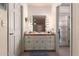 Bathroom featuring a vanity with a granite countertop, and a lighted mirror at 7131 N 40Th St, Paradise Valley, AZ 85253