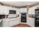 Bright kitchen with white cabinetry, modern appliances, and plenty of counter space for meal preparation at 7131 N 40Th St, Paradise Valley, AZ 85253