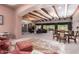 Expansive living room with exposed beam ceiling, neutral colors, and multiple seating areas at 7131 N 40Th St, Paradise Valley, AZ 85253
