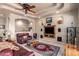 Open-concept living room with tray ceilings, ceiling fans, and custom built-ins for visual appeal at 7131 N 40Th St, Paradise Valley, AZ 85253
