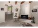 Bright living room features a brick fireplace, neutral paint, and a staircase to another level at 7131 N 40Th St, Paradise Valley, AZ 85253