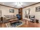 Living room featuring tile floors, ceiling fan, and access to another living space at 7131 N 40Th St, Paradise Valley, AZ 85253