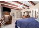 Bright main bedroom with a beamed ceiling, flat screen television, and a sliding glass door at 7131 N 40Th St, Paradise Valley, AZ 85253