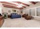 Serene main bedroom with exposed beam ceiling, ample natural light, and comfortable furnishings at 7131 N 40Th St, Paradise Valley, AZ 85253