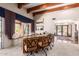 Spacious office with custom built-ins, a large window view, brick accents, and exposed wood beams at 7131 N 40Th St, Paradise Valley, AZ 85253