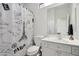 Bright bathroom featuring a white vanity, toilet, and Paris-themed shower curtain at 7169 E Bramble Berry Ln, Scottsdale, AZ 85266