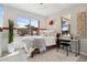 Comfortable bedroom with large window and access to the outdoor patio at 7169 E Bramble Berry Ln, Scottsdale, AZ 85266