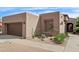 Single-level home exterior features a two-car garage and desert landscaping at 7169 E Bramble Berry Ln, Scottsdale, AZ 85266