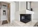 Living area with cozy fireplace and tile flooring at 7169 E Bramble Berry Ln, Scottsdale, AZ 85266