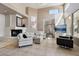 Bright living room with high ceilings, fireplace, and neutral decor at 7169 E Bramble Berry Ln, Scottsdale, AZ 85266