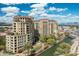 Stunning aerial view of waterfront property and community featuring palm trees and cityscape views at 7175 E Camelback Rd # 510, Scottsdale, AZ 85251