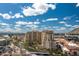 Beautiful view from above of condo building showcasing green spaces, a canal, and mountain backdrop at 7175 E Camelback Rd # 510, Scottsdale, AZ 85251