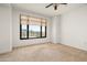 This bedroom is ready for your personal touches with carpeted floors and a bright window view at 7175 E Camelback Rd # 510, Scottsdale, AZ 85251