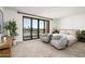 This bedroom features a neutral color scheme, carpeted floors and a balcony with city views at 7175 E Camelback Rd # 510, Scottsdale, AZ 85251