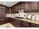 Well-appointed kitchen featuring granite countertops, mosaic backsplash, and gas cooktop at 7175 E Camelback Rd # 510, Scottsdale, AZ 85251