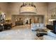 Spacious lobby with high ceilings, marble floors, fireplace and comfortable seating, creating a welcoming atmosphere at 7175 E Camelback Rd # 510, Scottsdale, AZ 85251