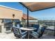 Luxurious outdoor kitchen with a built-in grill, countertop, and comfortable seating with city views at 7175 E Camelback Rd # 510, Scottsdale, AZ 85251