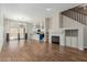 Stylish living area boasting hardwood floors, a modern fireplace, and seamless access to a bright, open kitchen area at 7204 S Golfside Ln, Phoenix, AZ 85042