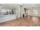 Spacious living area offering hardwood floors and seamless connectivity to the kitchen, creating a modern and inviting atmosphere at 7204 S Golfside Ln, Phoenix, AZ 85042