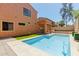 Inviting backyard with a refreshing pool, stucco house and patio for relaxation and entertaining at 7204 S Golfside Ln, Phoenix, AZ 85042