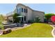 Backyard featuring artificial turf, stone accents, and landscaping, perfect for outdoor enjoyment at 7242 W Aurora Dr, Glendale, AZ 85308
