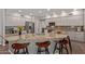 Island kitchen featuring stainless steel appliances, granite counters, and white cabinets at 7242 W Aurora Dr, Glendale, AZ 85308
