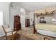 Spacious main bedroom features a four poster bed and natural light at 7242 W Aurora Dr, Glendale, AZ 85308