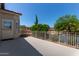 Exterior patio features a metal railing offering neighborhood views and sunlit spaces at 7242 W Aurora Dr, Glendale, AZ 85308