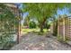 Well-maintained backyard features a rock garden, greenery, and pavers at 7508 E Aster Dr, Scottsdale, AZ 85260
