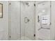 Bright bathroom with tiled shower and glass doors, showcases an airy and functional design at 7508 E Aster Dr, Scottsdale, AZ 85260