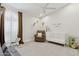 Bedroom with vaulted ceilings, rocking horse, recliner, and white crib with neutral décor at 7508 E Aster Dr, Scottsdale, AZ 85260