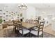 Open-concept dining area with a wooden table and seamless flow to the living spaces at 7508 E Aster Dr, Scottsdale, AZ 85260
