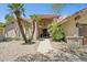Inviting front entrance with a decorative door, desert landscaping, and the house number clearly displayed at 7508 E Aster Dr, Scottsdale, AZ 85260