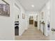 This is a hallway leading to the main bedroom, wine storage, and other rooms of the house at 7508 E Aster Dr, Scottsdale, AZ 85260