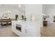 Spacious kitchen island with microwave and white countertop, open to the dining and living areas at 7508 E Aster Dr, Scottsdale, AZ 85260