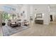 Spacious living room with wood floors, neutral furniture, stylish decor, and an open floor plan at 7508 E Aster Dr, Scottsdale, AZ 85260