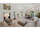 Open-concept living space showcasing a fireplace, dining area, and view into the kitchen at 7508 E Aster Dr, Scottsdale, AZ 85260