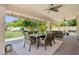 Spacious covered patio includes an outdoor dining area and comfortable seating for relaxing and entertaining at 7508 E Aster Dr, Scottsdale, AZ 85260