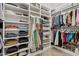 Spacious walk-in closet with custom shelving and plenty of space for clothes, shoes, and accessories at 7508 E Aster Dr, Scottsdale, AZ 85260