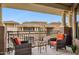Balcony with wrought iron railing and comfortable seating at 7601 E Indian Bend Rd # 3002, Scottsdale, AZ 85250
