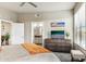 Bedroom with large dresser, television, view to bathroom, and door to the left at 7601 E Indian Bend Rd # 3002, Scottsdale, AZ 85250