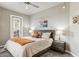 Comfortable bedroom features a ceiling fan, soft gray walls, and a door to the outside at 7601 E Indian Bend Rd # 3002, Scottsdale, AZ 85250