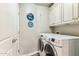 Laundry room with full size white washer and dryer at 7601 E Indian Bend Rd # 3002, Scottsdale, AZ 85250