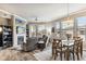 Cozy living area with fireplace flowing to dining space; great natural light and modern decor at 7601 E Indian Bend Rd # 3002, Scottsdale, AZ 85250