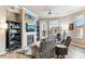 Comfortable living room with fireplace, ceiling fan, and plush seating at 7601 E Indian Bend Rd # 3002, Scottsdale, AZ 85250