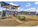Community playground with climbing features and slides for children in a new housing development at 8149 E Petunia Ave # 1013, Mesa, AZ 85212