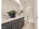 Elegant bathroom with a double sink vanity, frameless glass shower, and modern fixtures at 8149 E Petunia Ave # 1042, Mesa, AZ 85212